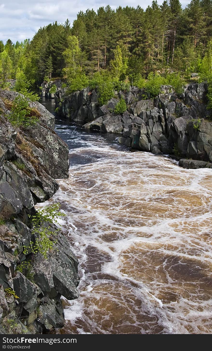 Lower Vyg river in Nadvoitsy settlement, just after Voitsky Padun waterfall, Karelia, Northern Russia.