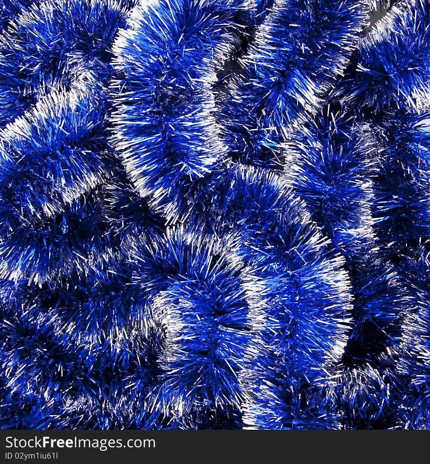 Christmas background made from blue shiny decoration