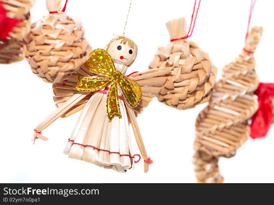 Christmas decorations - straw angel isolated on white