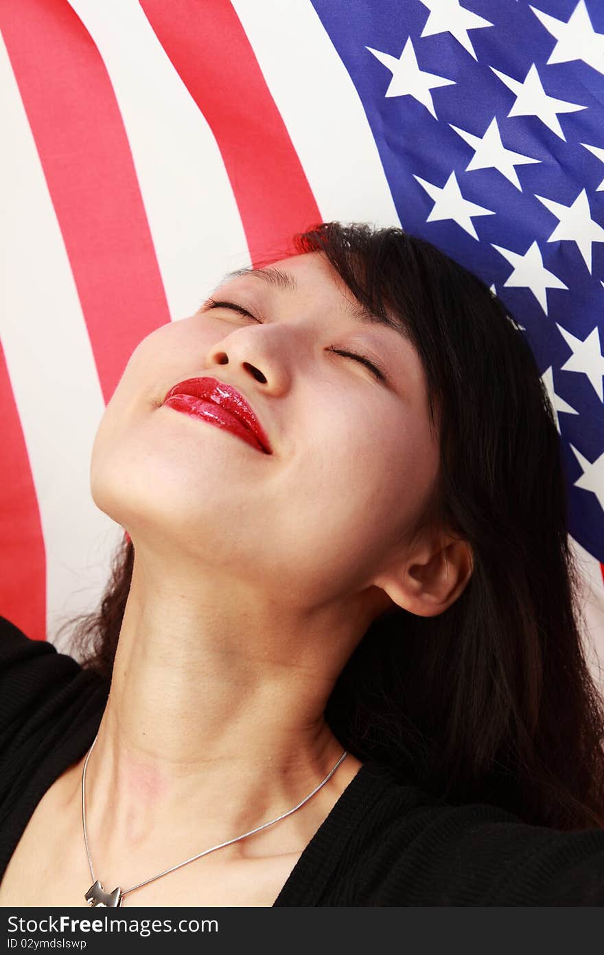 Attractive young woman with a US flag