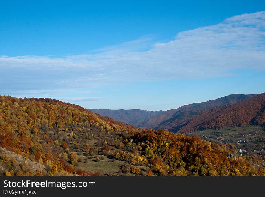 Autumn landscape foliage on blue sky