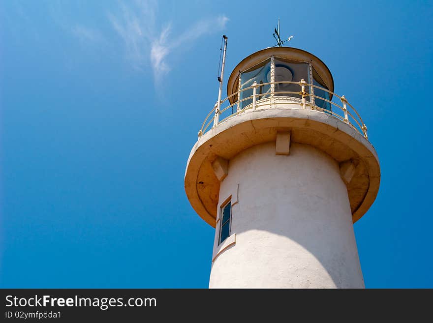 Lighthouse against a blue sky