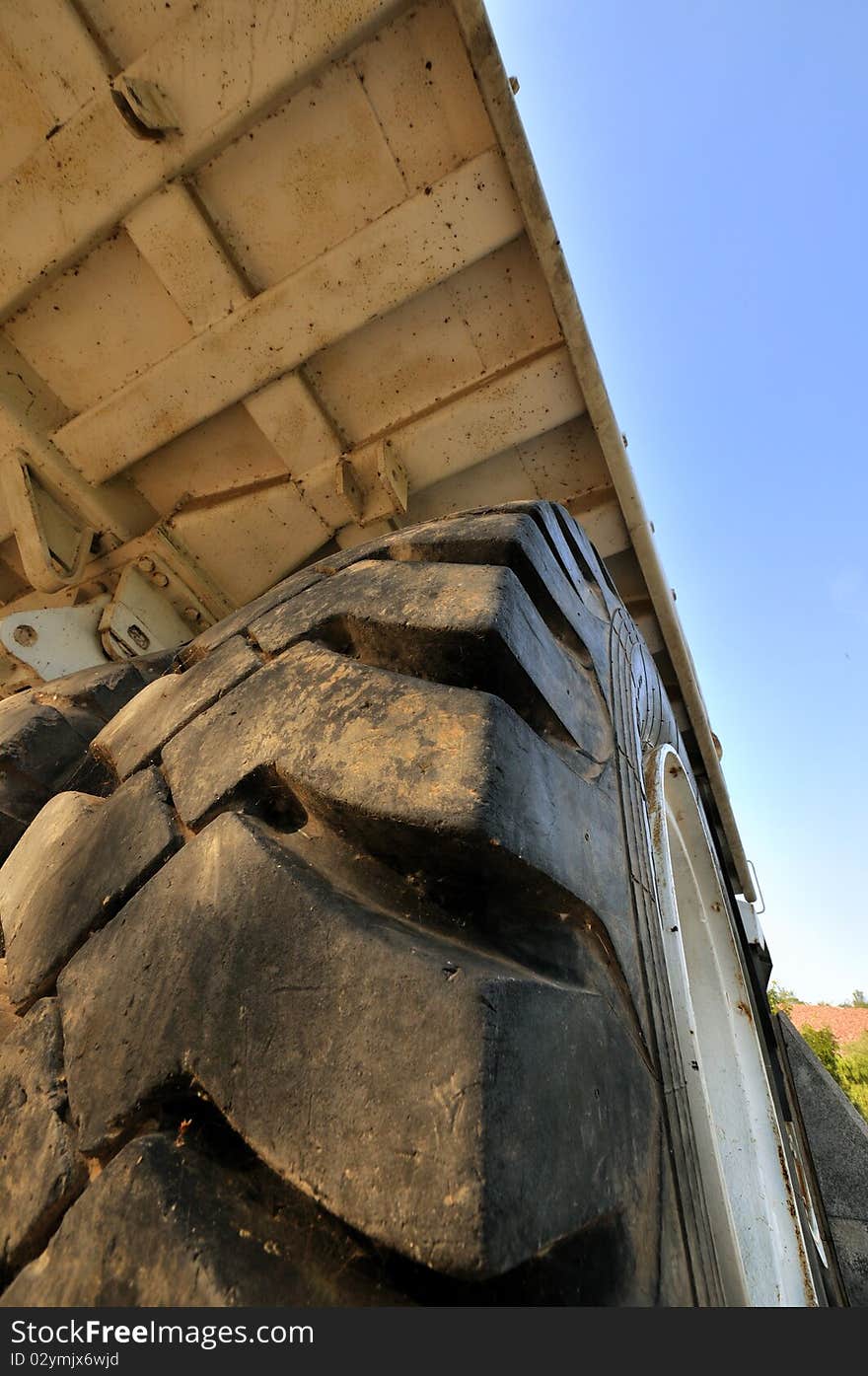 Tyre and body of big construction equipment