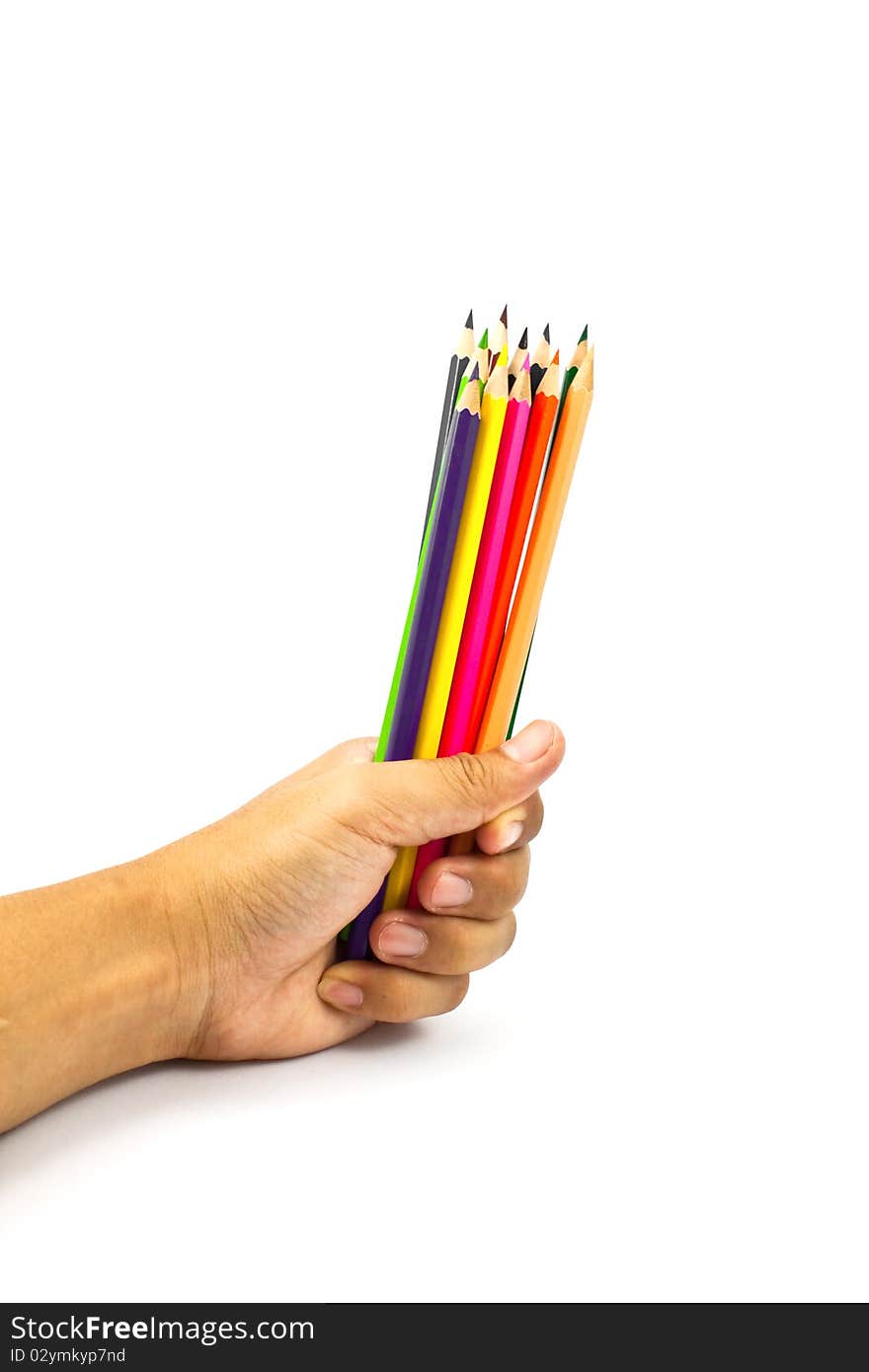 Color pencils in a hand isolated on white background. Color pencils in a hand isolated on white background.