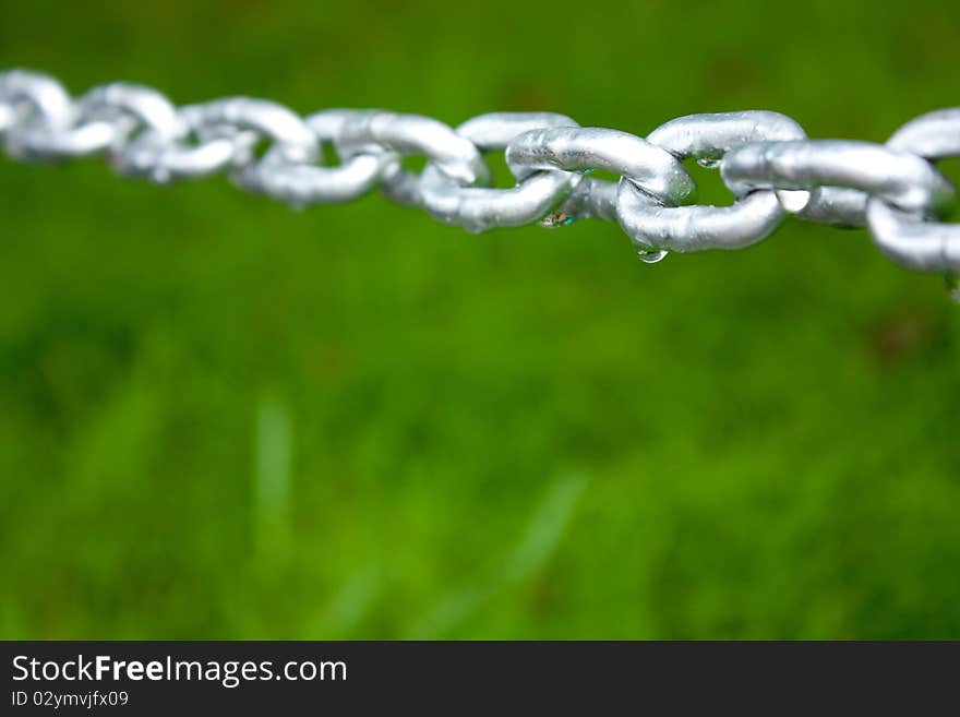 Chain after rainy above the green field. Chain after rainy above the green field.