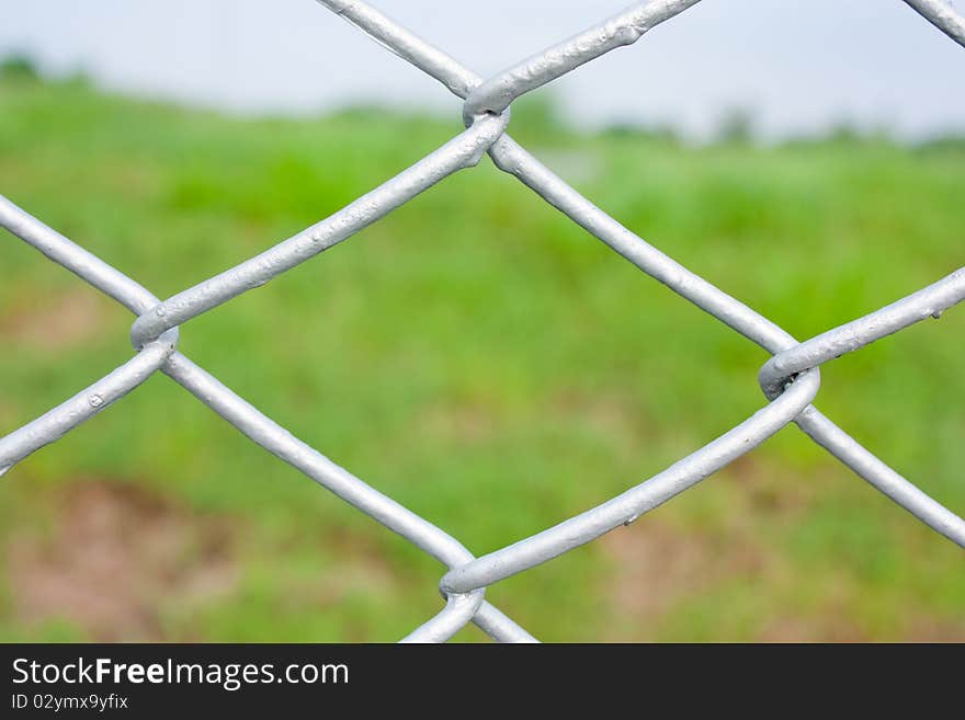 Steel chainlink that boundary land countryside highway. Steel chainlink that boundary land countryside highway.