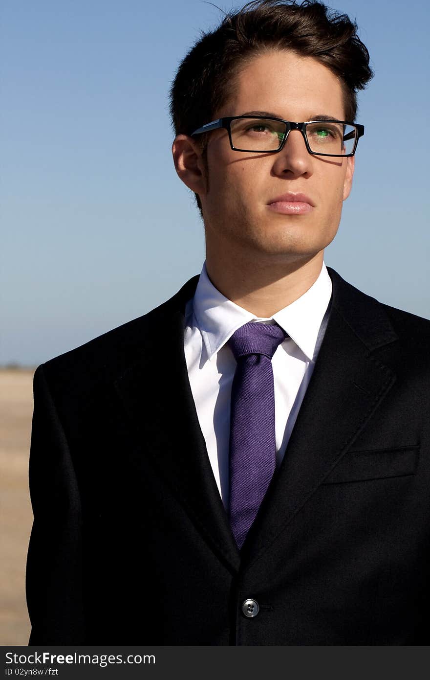 Close up view of a business man with glasses.