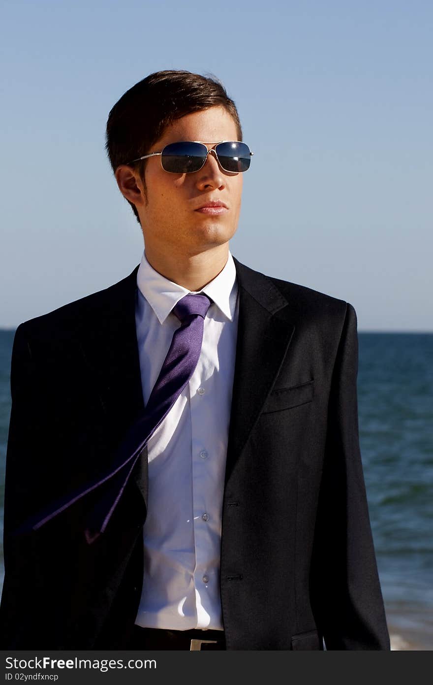 Close up view of a bunisess man in a dark suit. Close up view of a bunisess man in a dark suit.