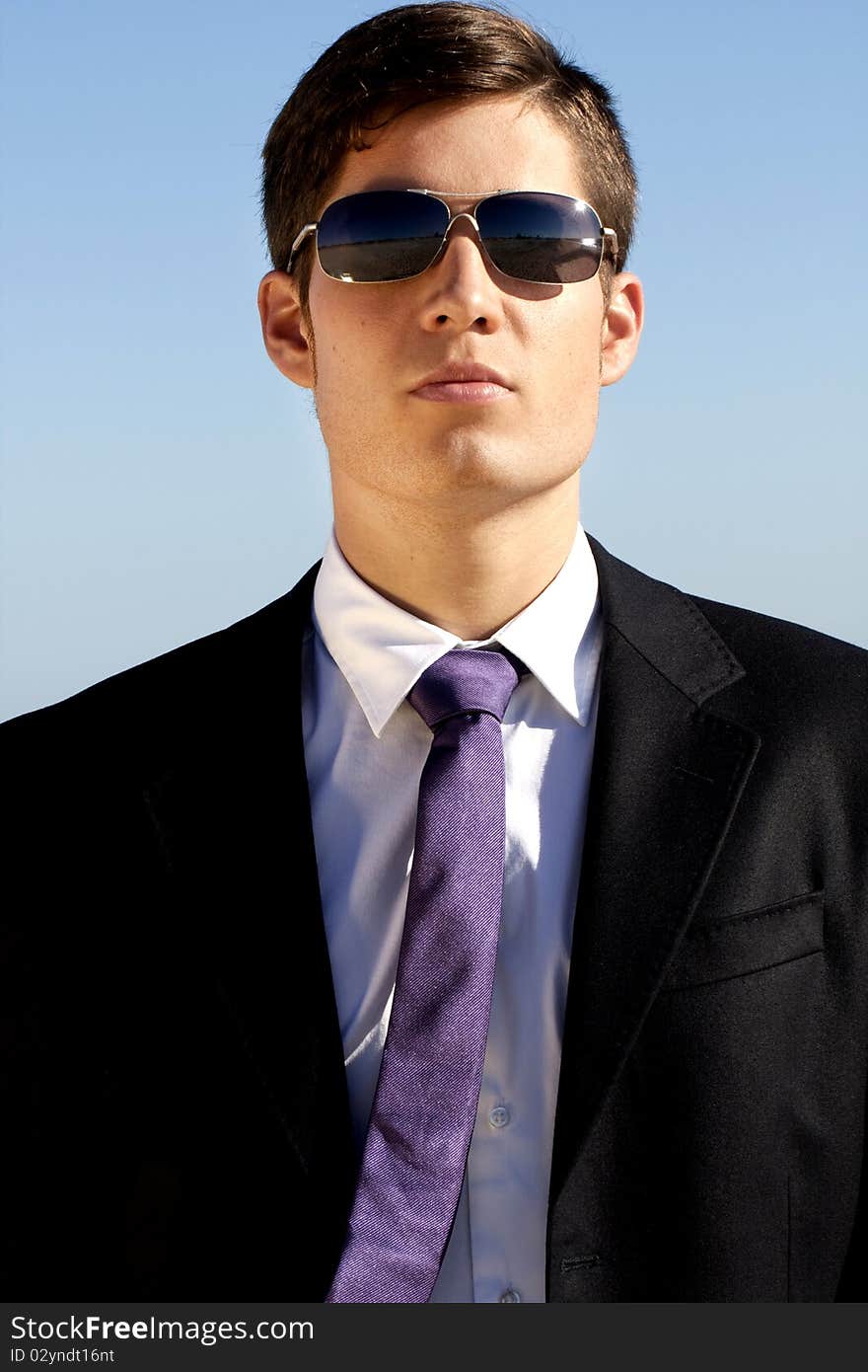 Close up view of a bunisess man in a dark suit. Close up view of a bunisess man in a dark suit.