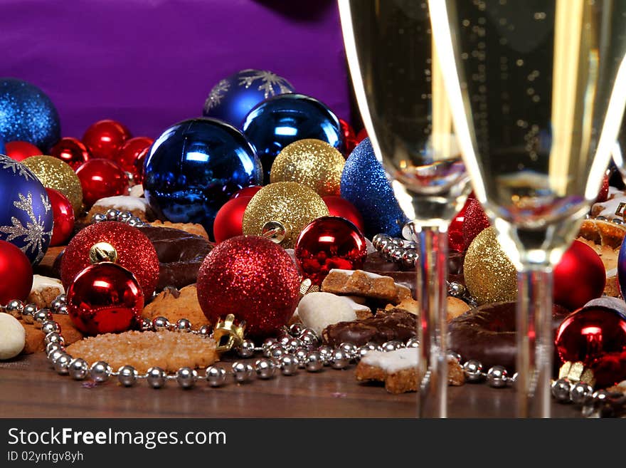 Glasses of champagne and some presents and christmas balls. Glasses of champagne and some presents and christmas balls