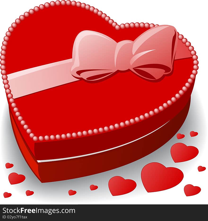 Red heart-shaped box decorated with a bow. Red heart-shaped box decorated with a bow