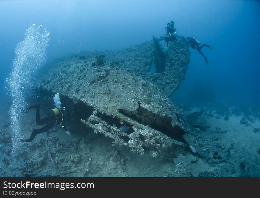 Scuba Diver Entering A Shipwreck.