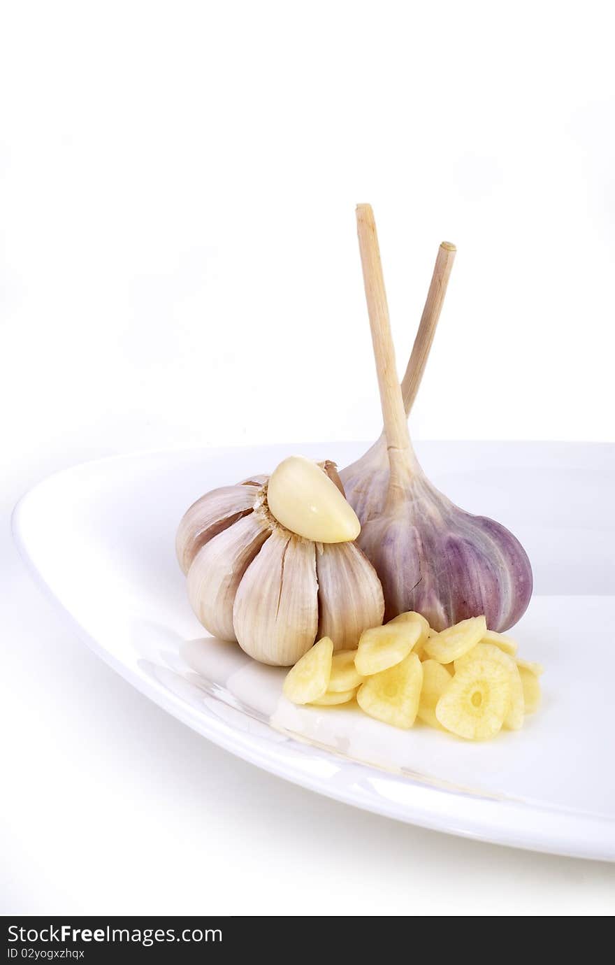 Garlic On A White Dish