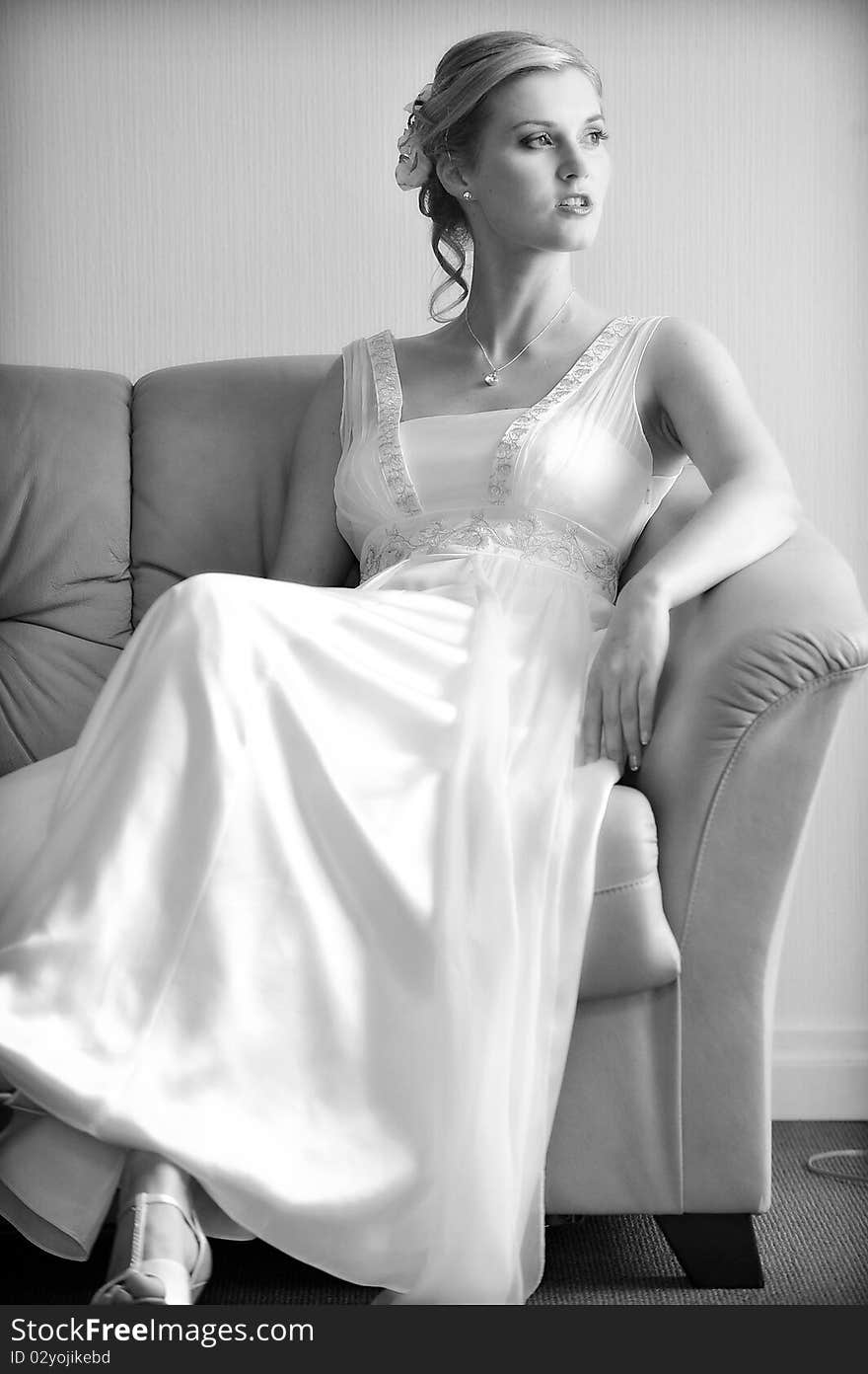 Beautiful stylish bride in white dress in room. Beautiful stylish bride in white dress in room