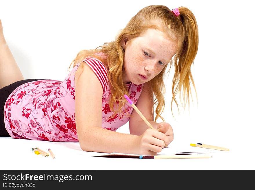 Redhead girl is doing her homework