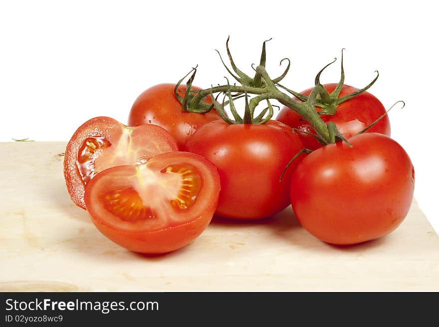 Fresh tomatoes isolated on white