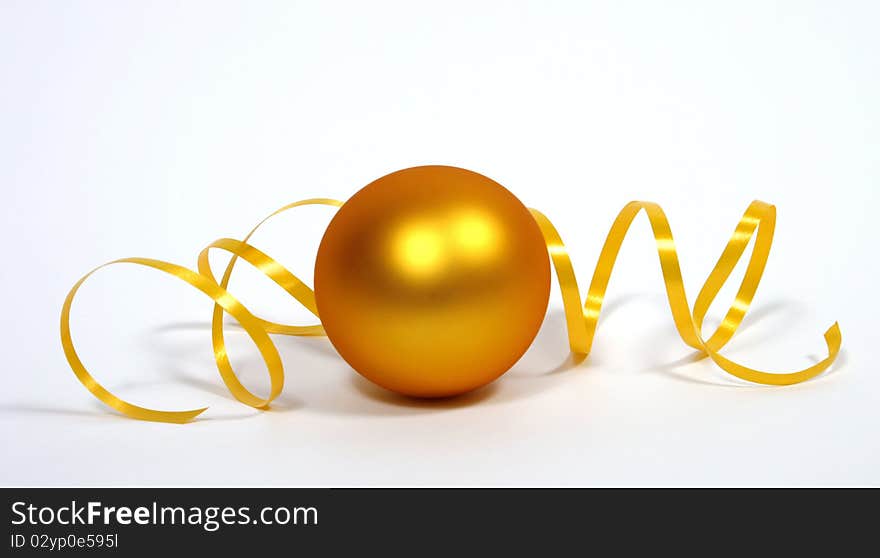 Yellow bauble with the yellow ribbon on the white background. Yellow bauble with the yellow ribbon on the white background