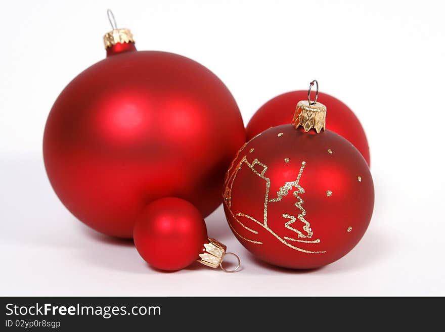 Red glass balls on the white background. Red glass balls on the white background