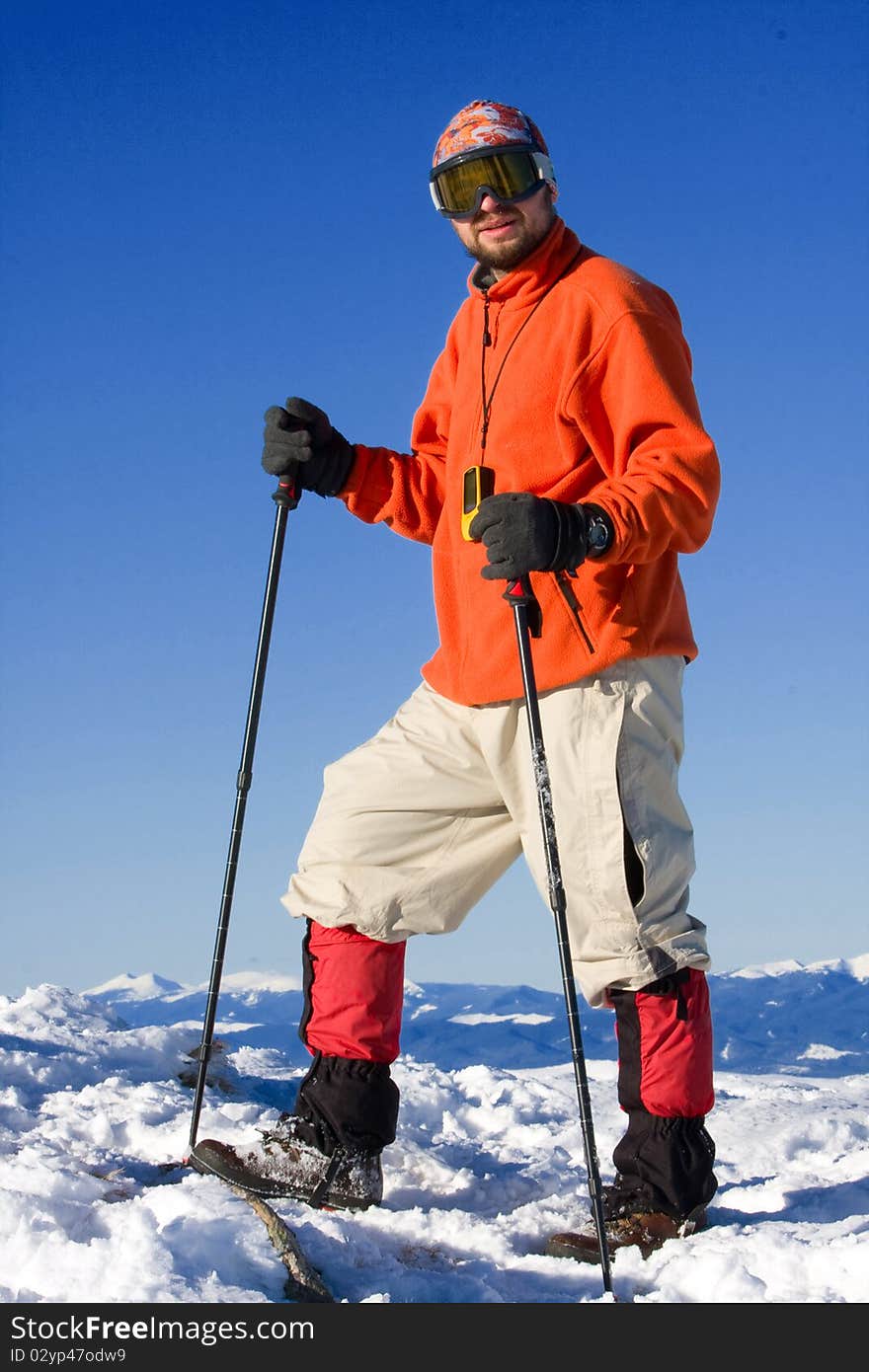 Hiker in winter in mountains