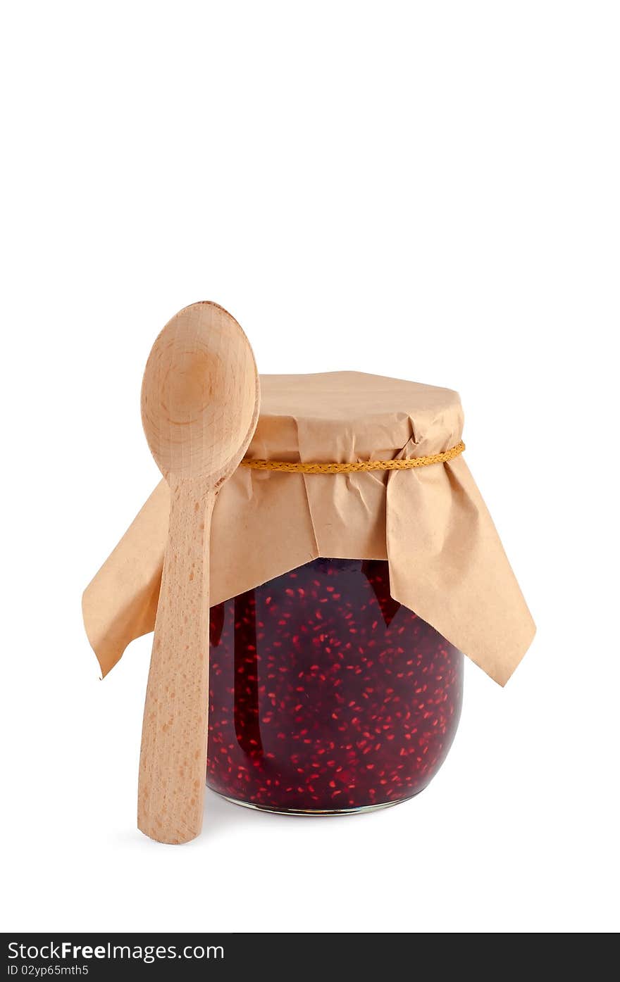 Jam in jar wooden spoon isolated.