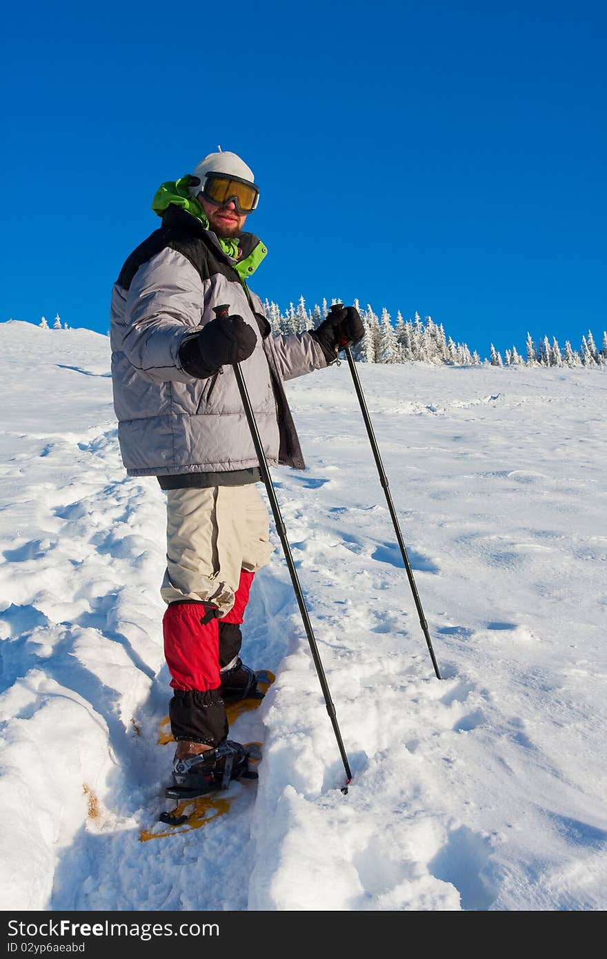 Hiker in winter in mountains