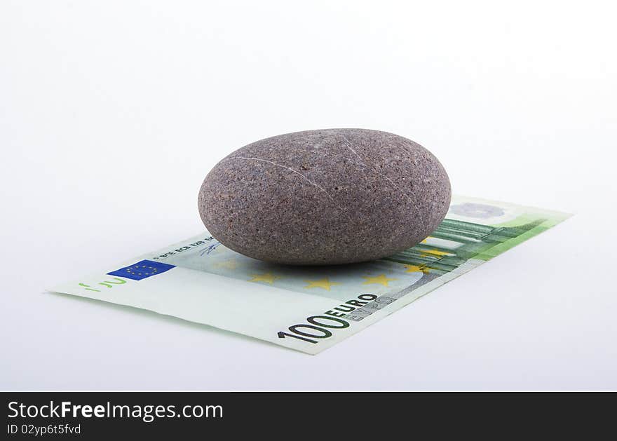 Euro Banknote Pressed Down By A Stone