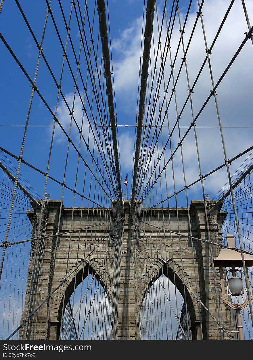 Brooklyn Bridge in New York with US Flag