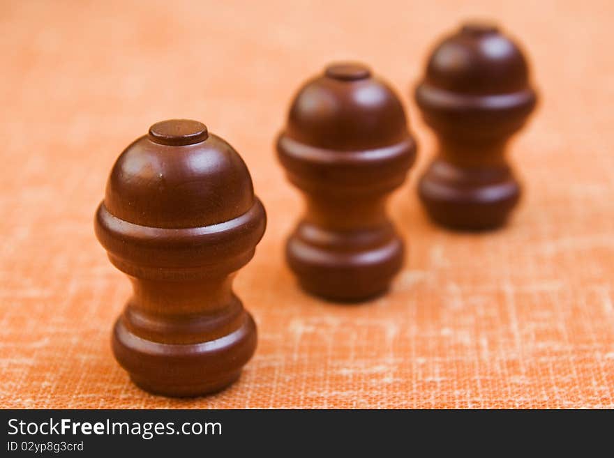 Three knobs located one after the other, wooden knobs. Three knobs located one after the other, wooden knobs