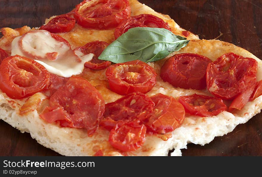 A flat oven-baked Italian bread, which may be topped with herbs or other ingredients. A flat oven-baked Italian bread, which may be topped with herbs or other ingredients