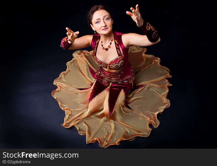 Woman in arabic dance look at you - studio shot. Woman in arabic dance look at you - studio shot