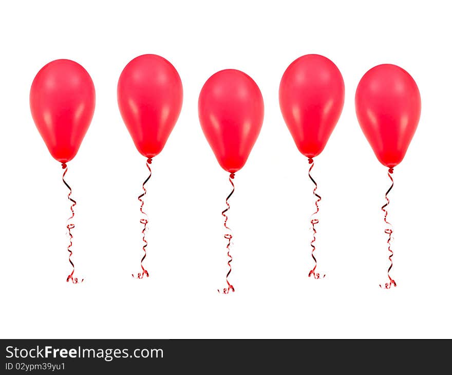 Red balloons isolated against a white background