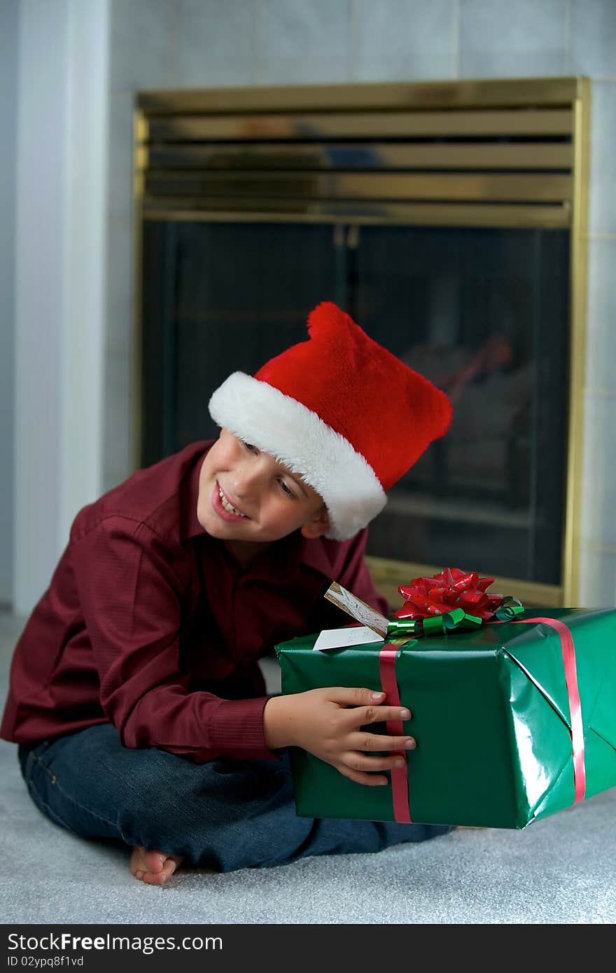 Boy in santa hat with gift