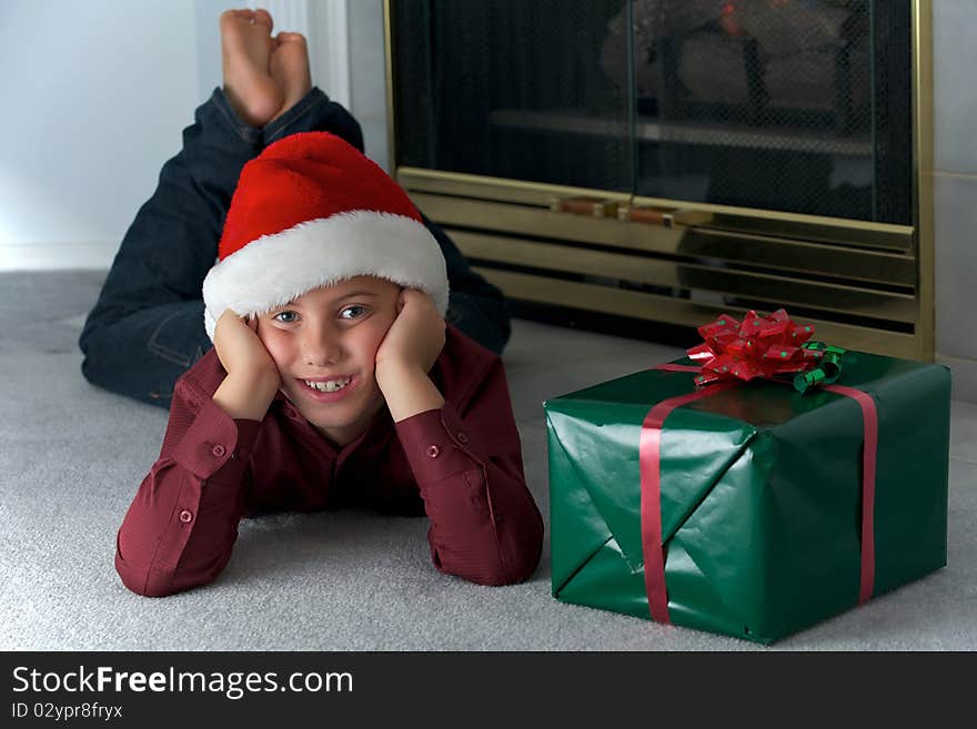 Eight year old boy in santa hat