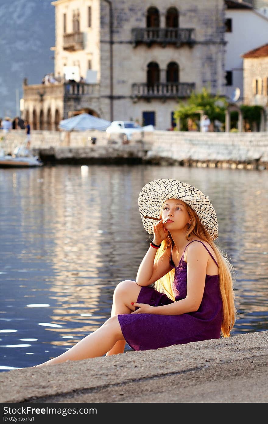 Beautiful woman relaxing by the sea in Montenegro