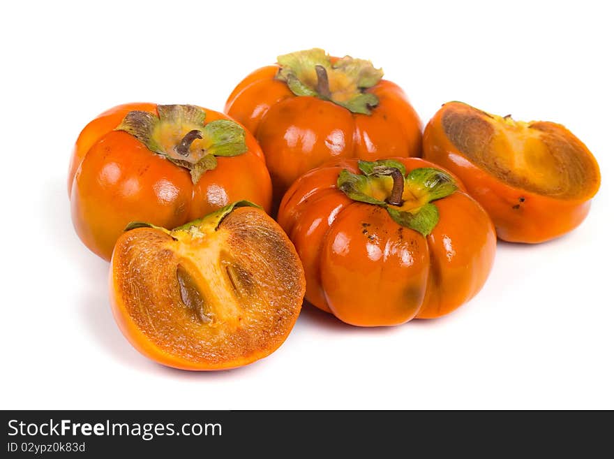 Ripe persimmons isolated on a white background