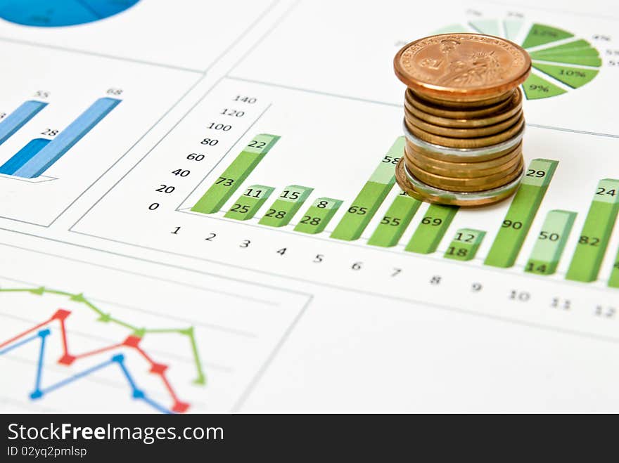 Graphs and charts with stacks of coins. Graphs and charts with stacks of coins