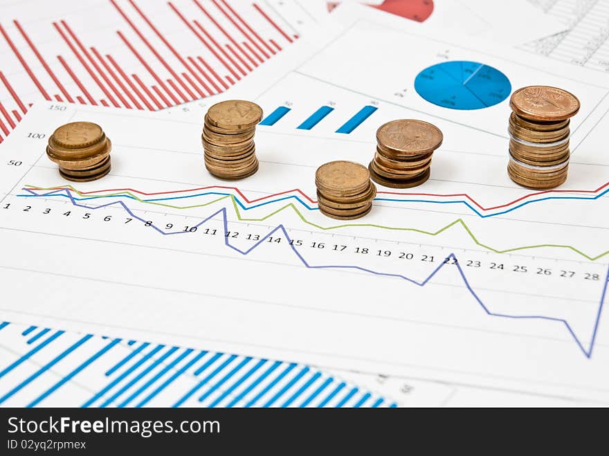 Graphs and charts with stacks of coins. Graphs and charts with stacks of coins