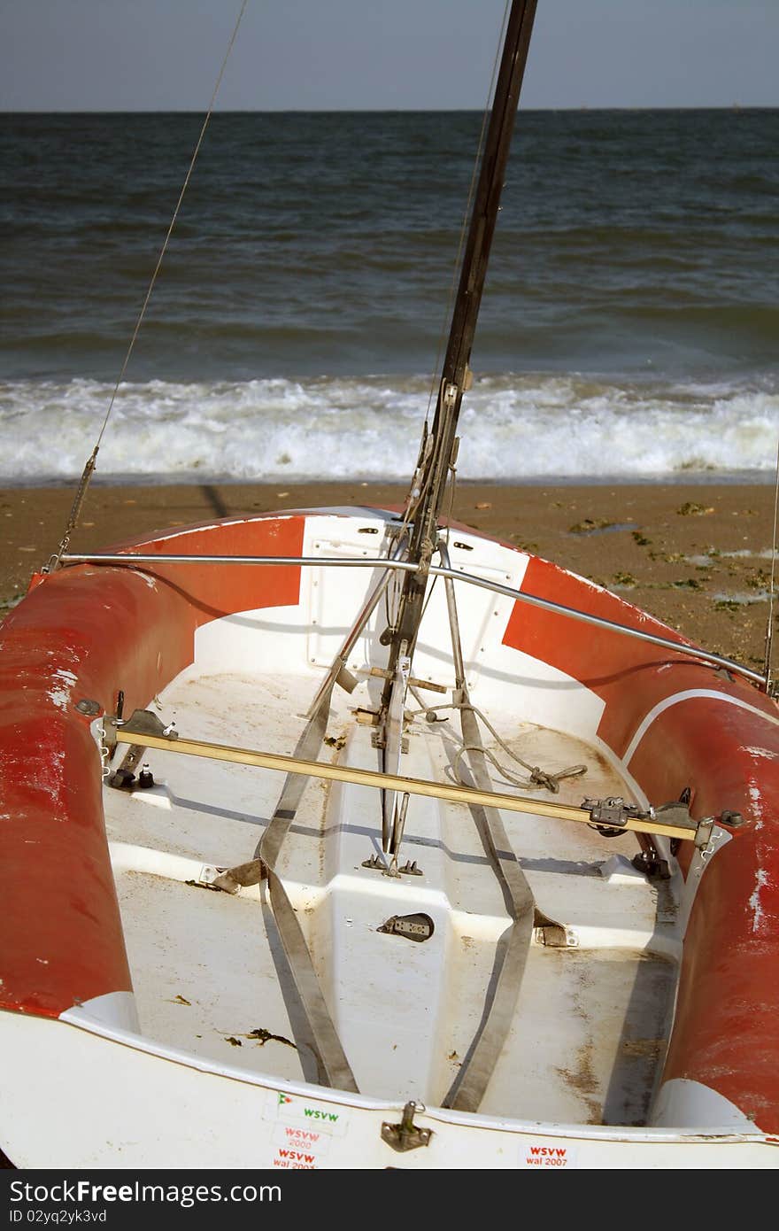 Boat on a beach aiming for the sea