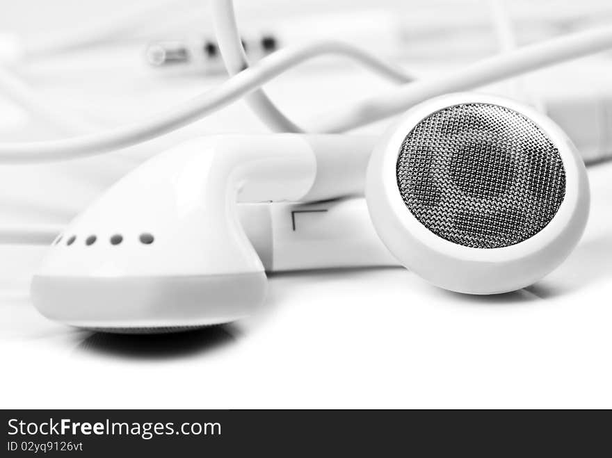 Macro close up of white earphones - very shallow depth field. Macro close up of white earphones - very shallow depth field