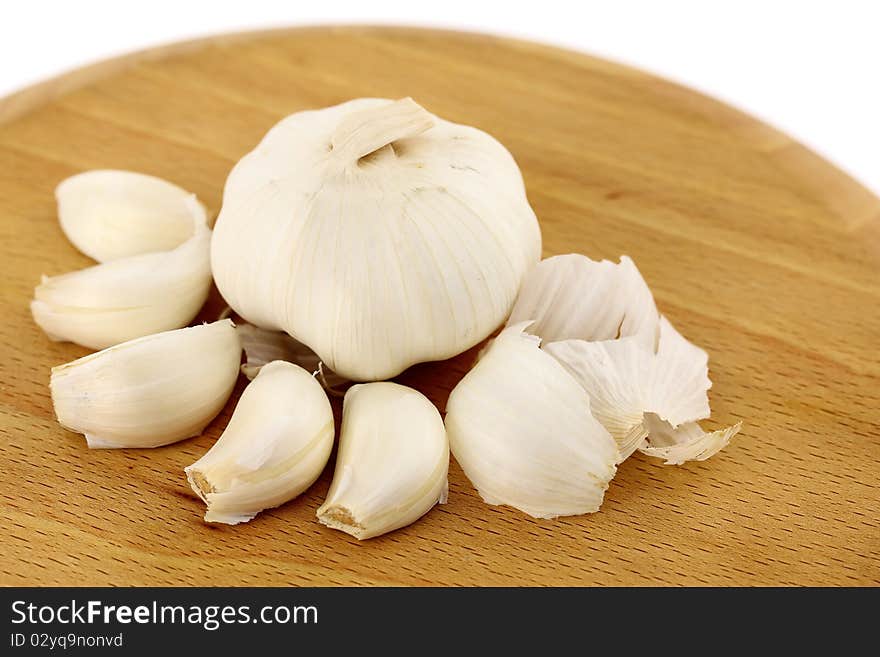 Garlic on a wooden plate