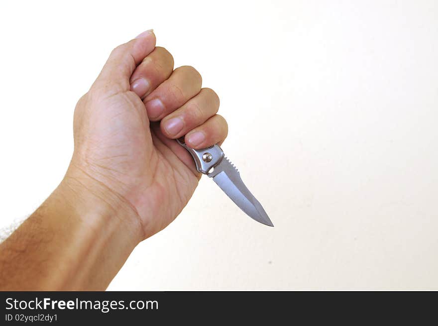 Hand holding a knife isolated on white background