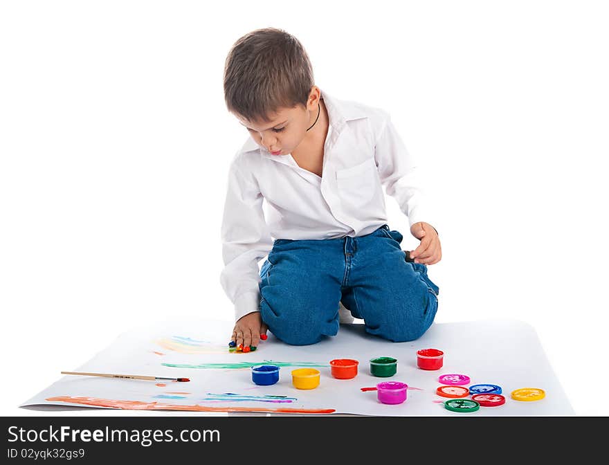 Adorable 4 year old boy with bright paint