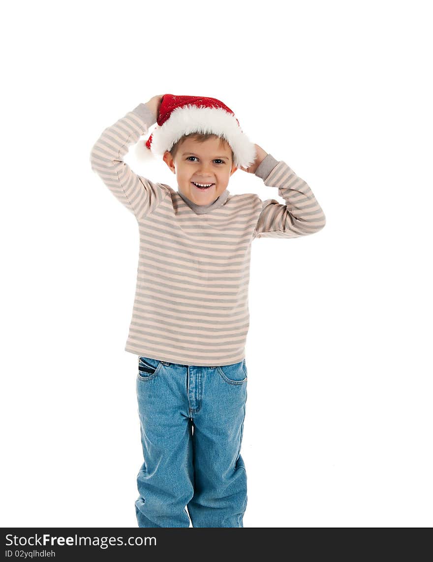 Little boy in a santa claus hat on white