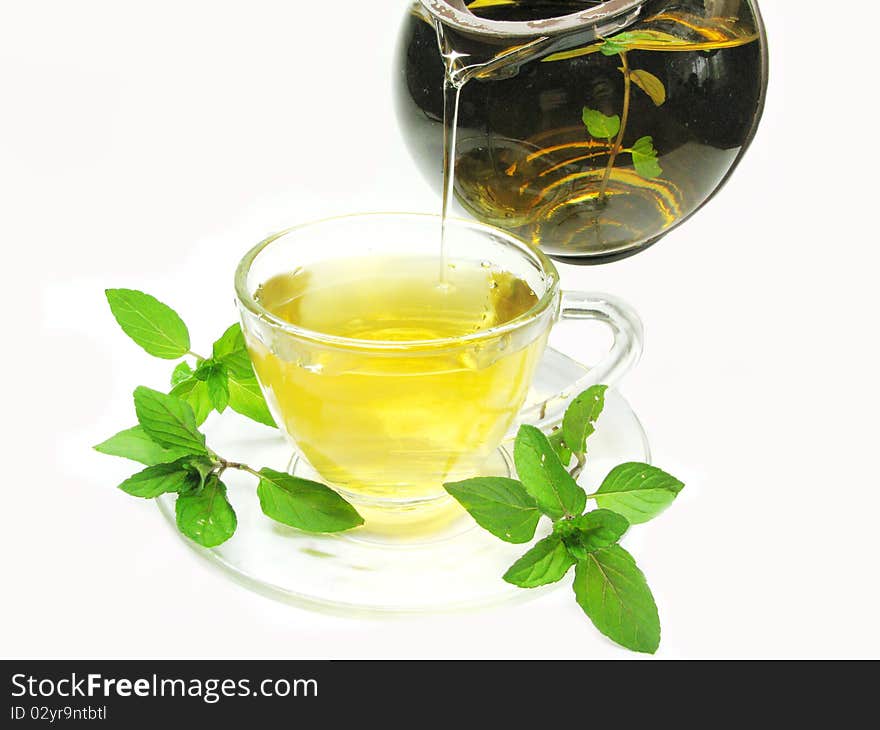 Pouring herbal tea with mint extract