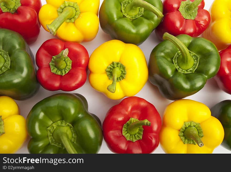 Colourful peppers on the white background