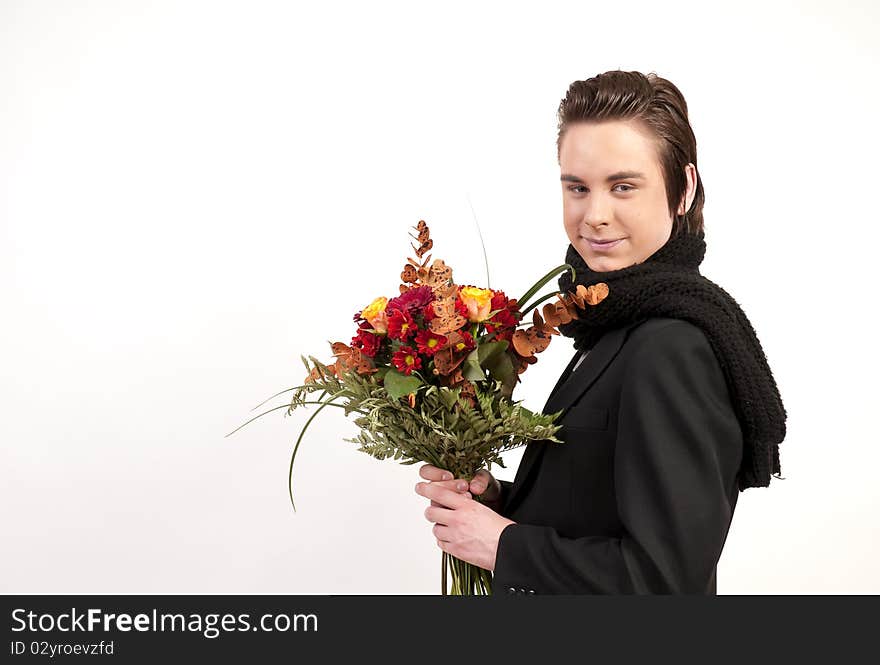 Teenager holding a bunch of flowers on white background. Teenager holding a bunch of flowers on white background.