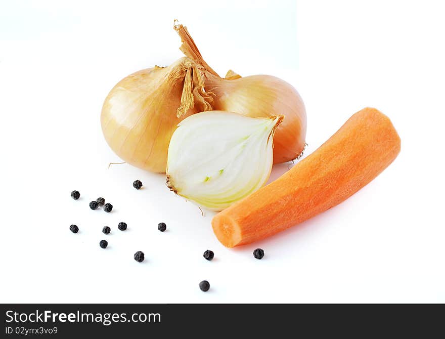 Onions, carrot and pepper prepared for cooking on white background