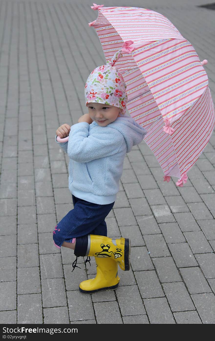 Little girl with pink umbrella. Little girl with pink umbrella