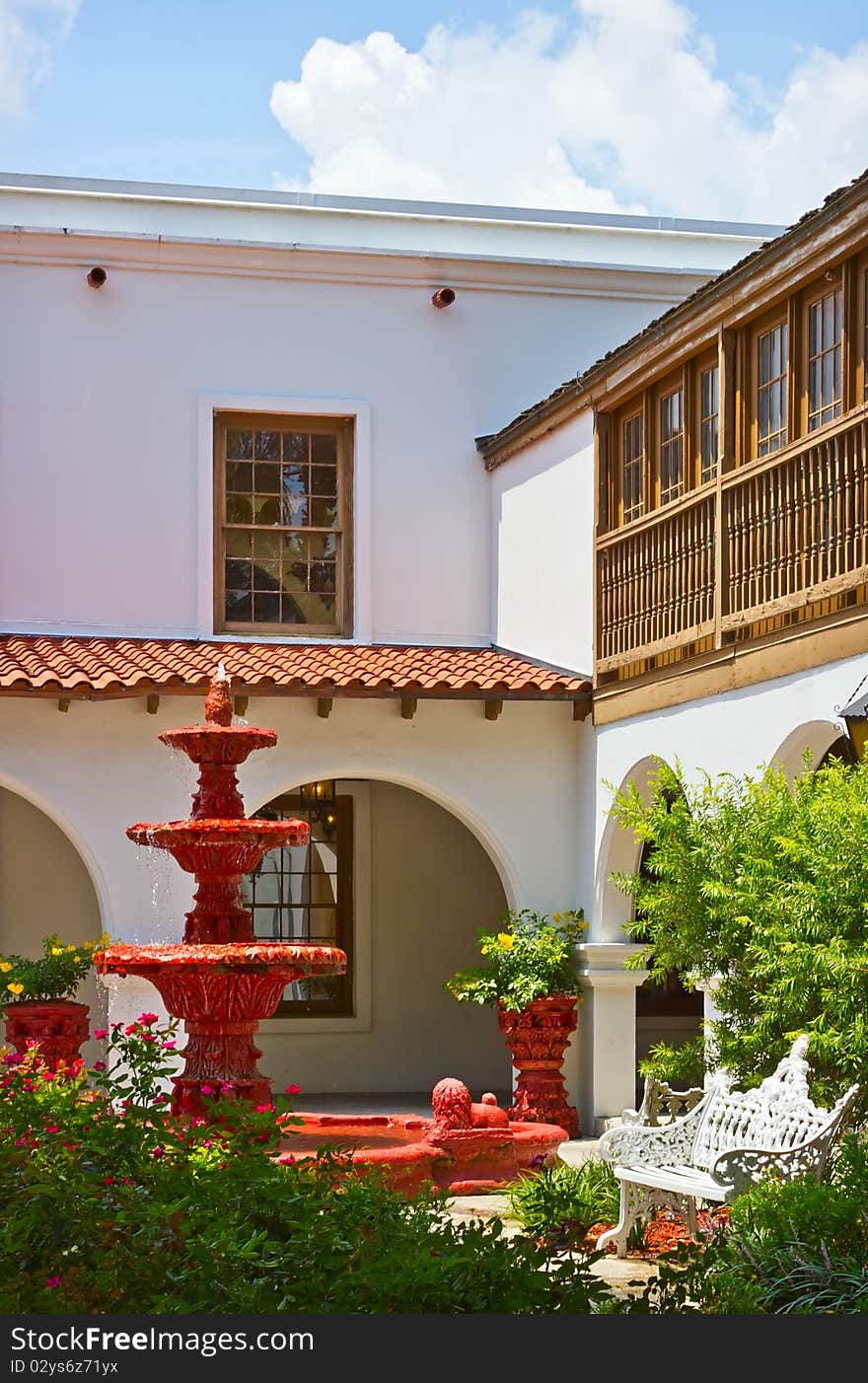 View of the spanish colonial style patio with red fountain in St. Augustine, Florida. View of the spanish colonial style patio with red fountain in St. Augustine, Florida