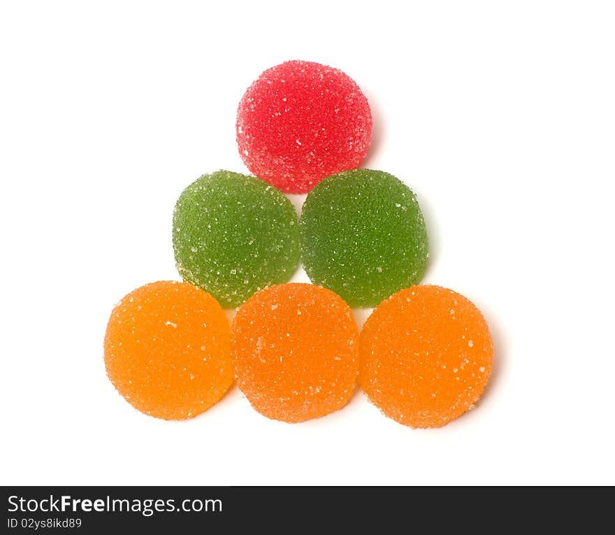 Triangle from color fruit candy on a white background. Triangle from color fruit candy on a white background.